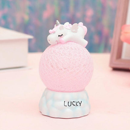 Nattlampa enhörning på rosa lysande boll