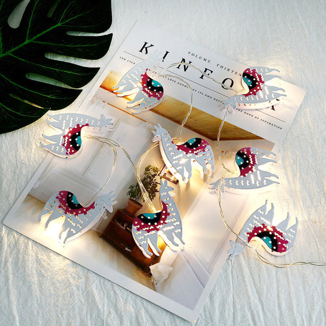 Dekorativ ljusslinga med söta lamor