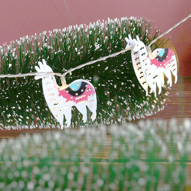 Dekorativ ljusslinga med söta lamor