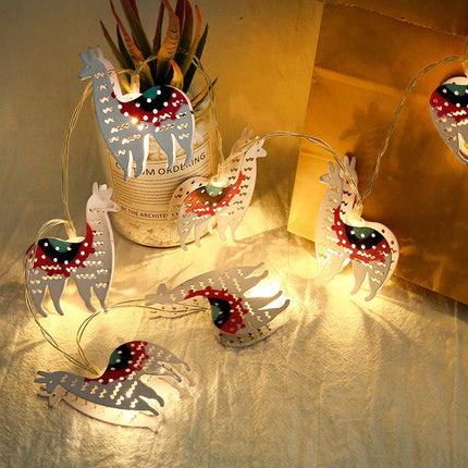 Dekorativ ljusslinga med söta lamor