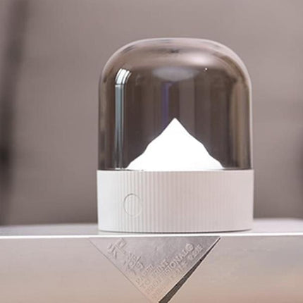 Sänglampa med upplyst berg under kupol