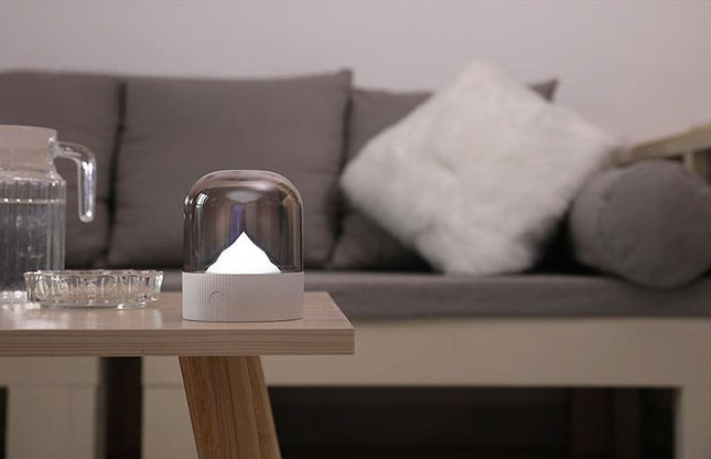 Sänglampa med upplyst berg under kupol