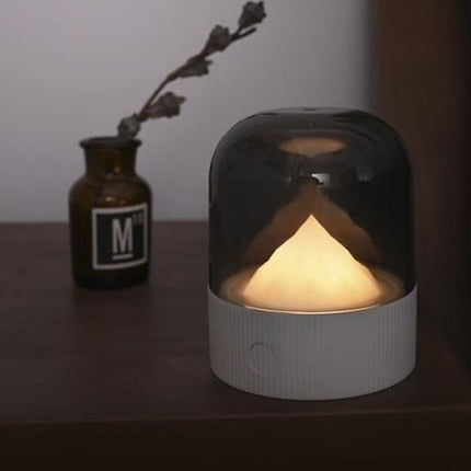 Sänglampa med upplyst berg under kupol