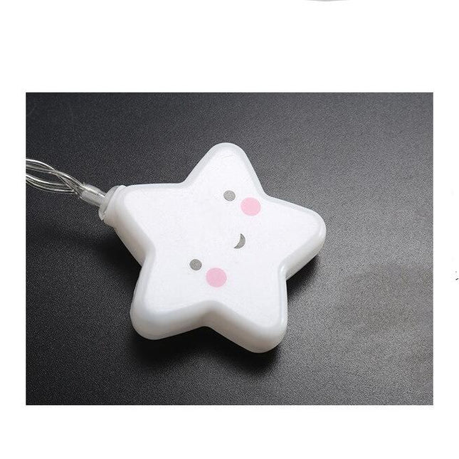 Vit ljusslinga med leende stjärnor