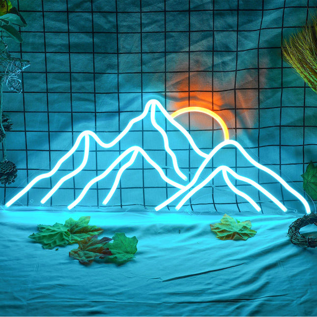 Blå neonlampa med fint bergsmotiv